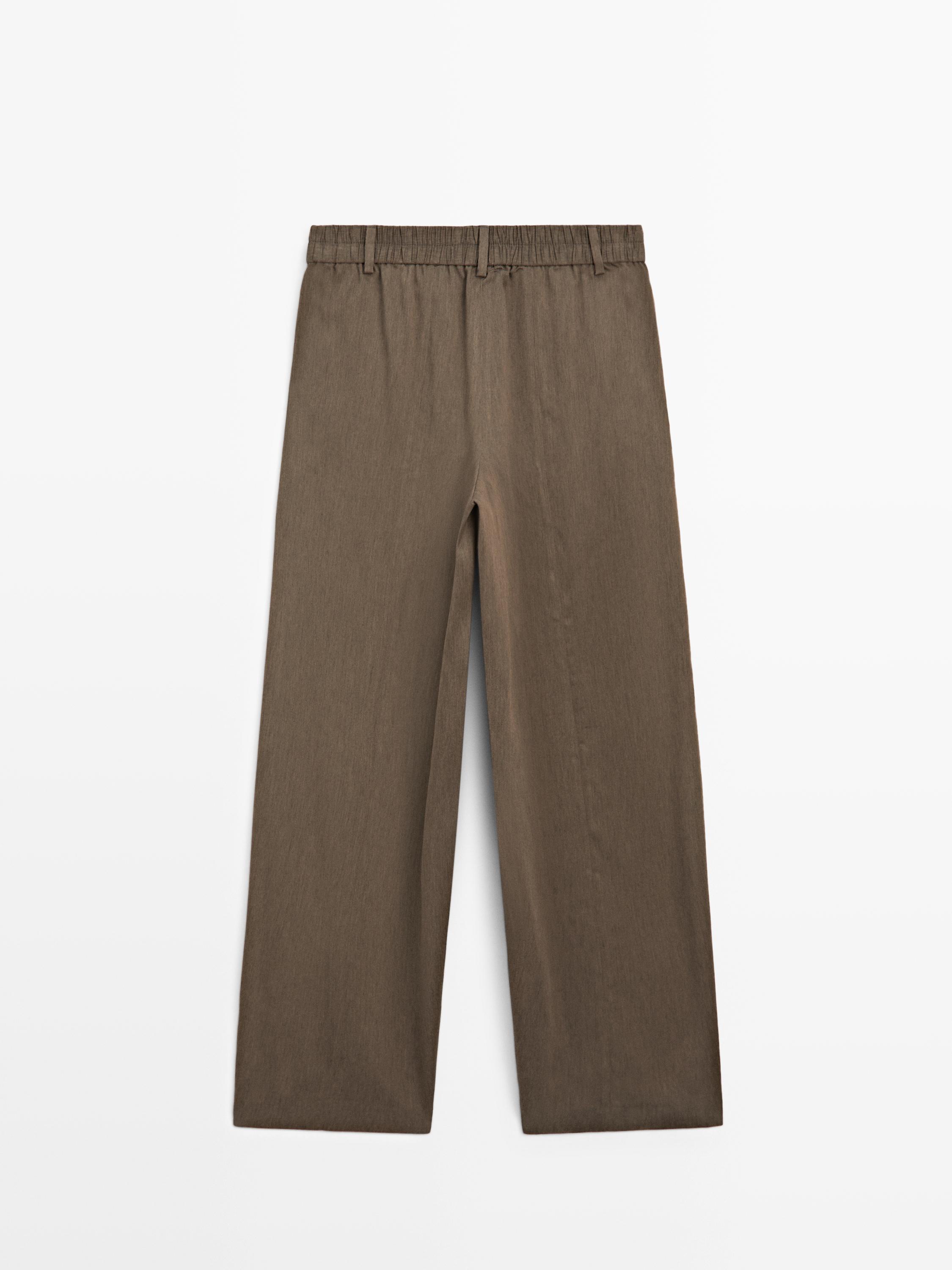 Flowing trousers with elasticated waistband
